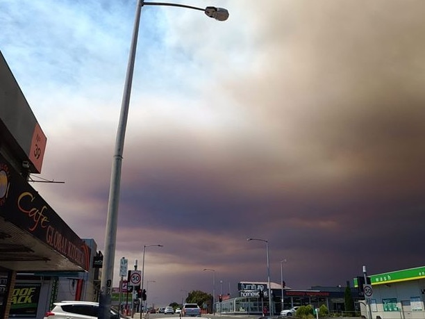 The darkened sky at Moonah, with haze from an uncontrolled bushfire burning near Maydena. Picture: SOAR SU