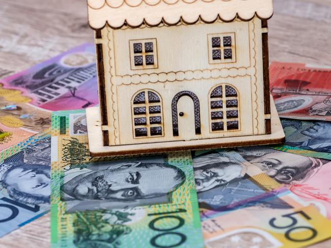 House model with australian dollar banknotes on table, generic money housing