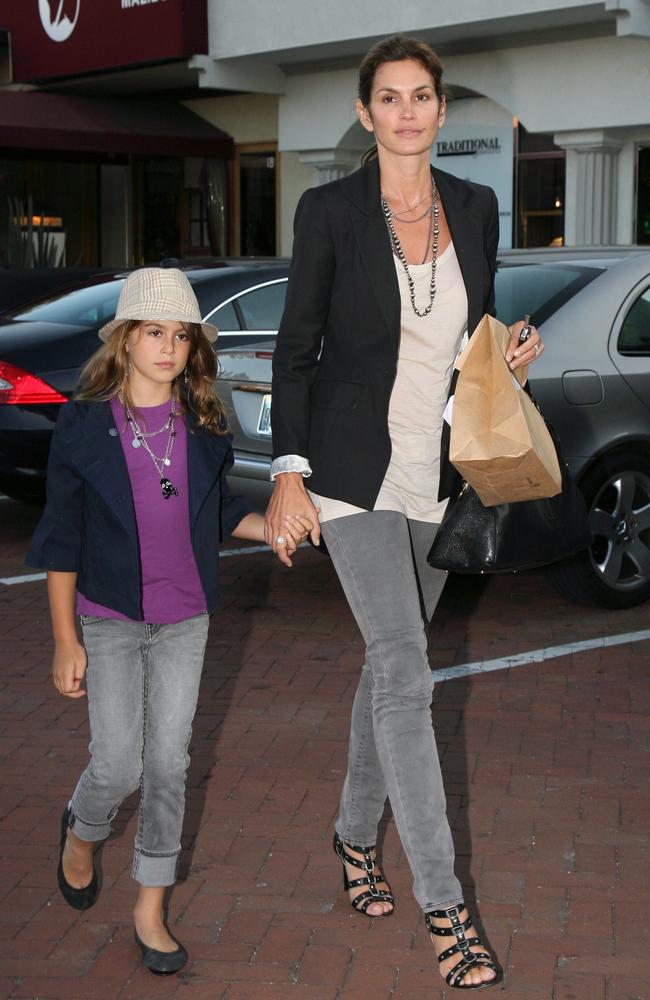 A young Kaia holding her mum’s hand in Malibu California. Picture by: SplashNews.com