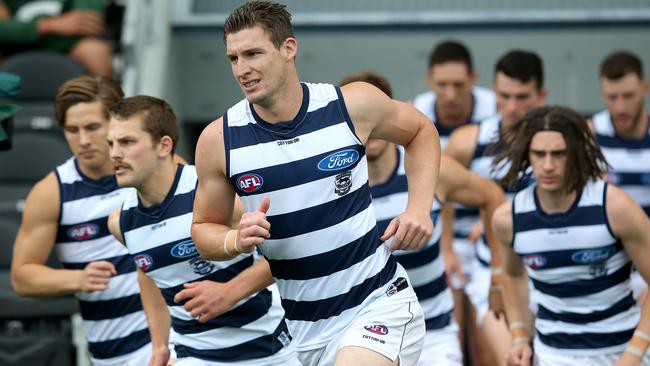 Former Crow Josh Jenkins, now with Geelong runs out with the team during the round 16 AFL match between the Geelong Cats and the Essendon Bombers at The Gabba. Picture: Jono Searle