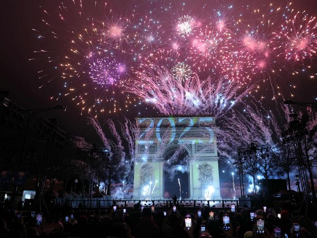 Fireworks illuminate the sky around the Arc de Triomphe on the Avenue des Champs-Elysees in Paris. Picture: AFP