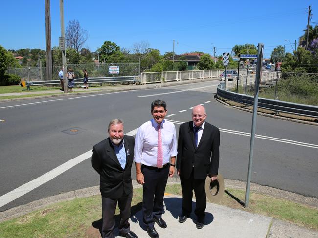 Parramatta and Cumberland mayors, Greg Cummings and Andrew Wilson, flank Parramatta state MP Geoff Lee at today’s announcement of widening Westmead’s Bridge Rd rail overpass to three lanes next year.