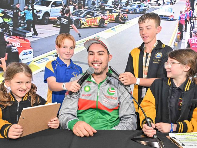 November 14, 2024: Kerryanne from Challa Gardens Primary, Jett from Tailem Bend Primary, Charlie from Brighton Primary and Alara from Challa Gardens Primary interview Supercar driver Thomas Randle at the Adelaide 500. Picture: Brenton Edwards