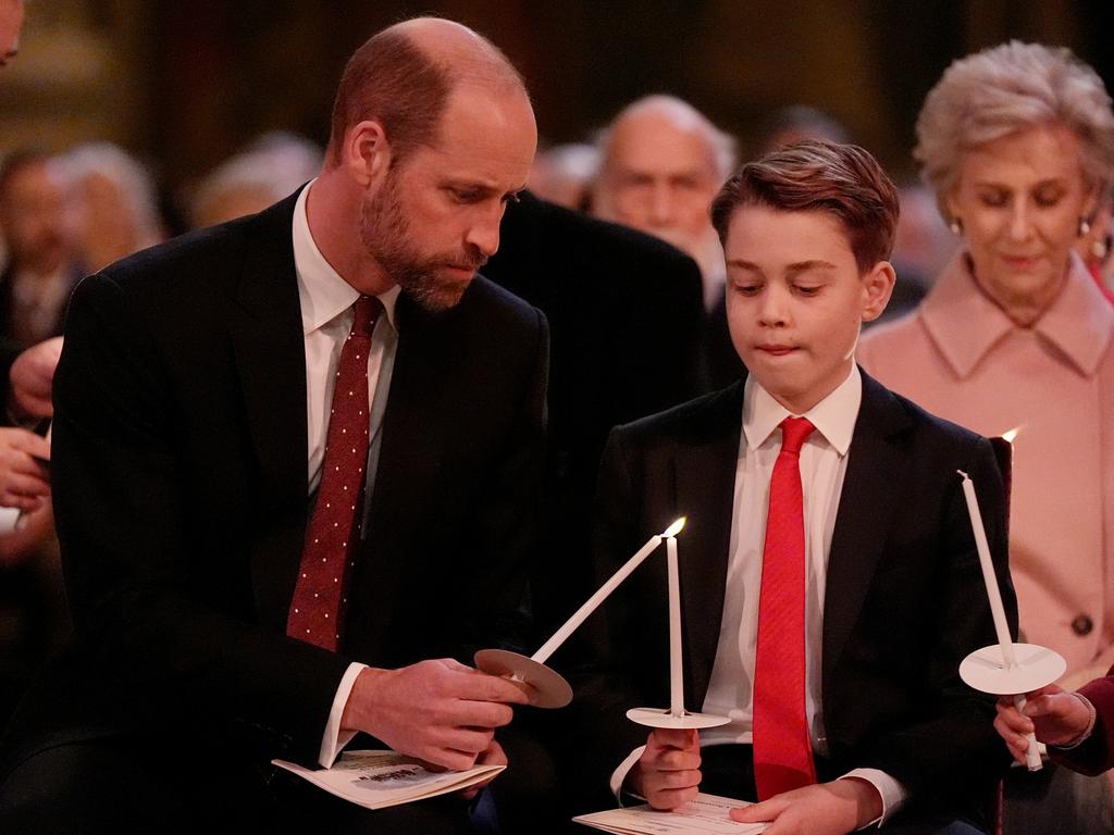 William was spotted helping George light his candle during one sweet moment. Picture: Aaron Chown - WPA Pool/Getty Images