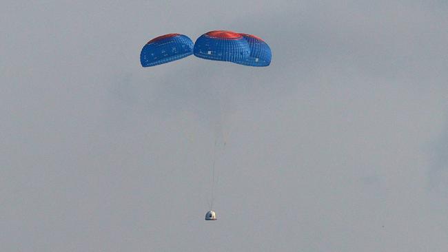 The New Shepard crew capsule descends on the end of its parachute system. Picture: AFP