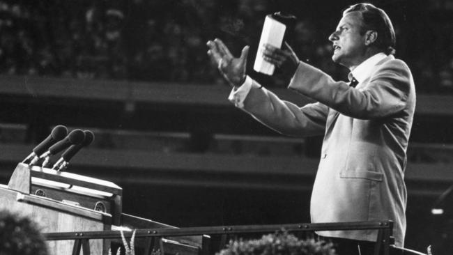 Billy Graham addressing a meeting in 1955. Picture; Getty Images.