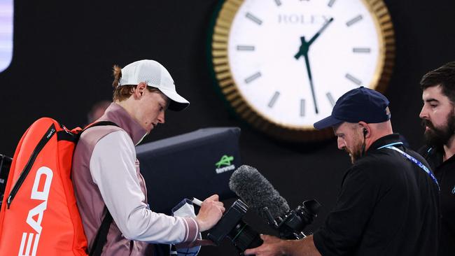 The clock ticks close to 1:30am at Melbourne Park after Italian Jannik Sinner’s victory. Picture: David Gray / AFP