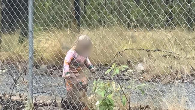 The toddler was seen wandering by herself on the inside of a closed military base.