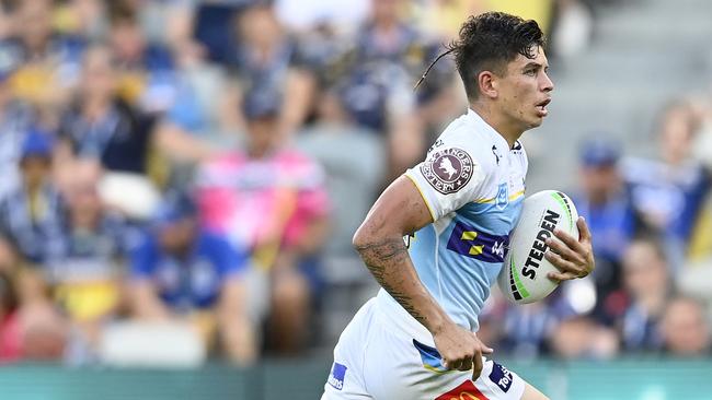 Jayden Campbell of the Titans runs the ball during the round four NRL match between North Queensland Cowboys and Gold Coast Titans at Qld Country Bank Stadium on March 25, 2023 in Townsville, Australia. (Photo by Ian Hitchcock/Getty Images)