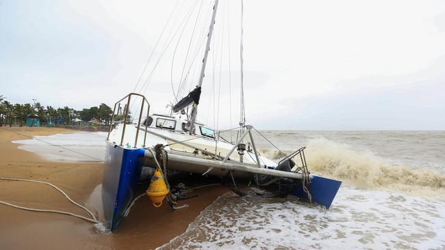 A catamaran washed up on the Strand on Sunday. Picture: Adam Head