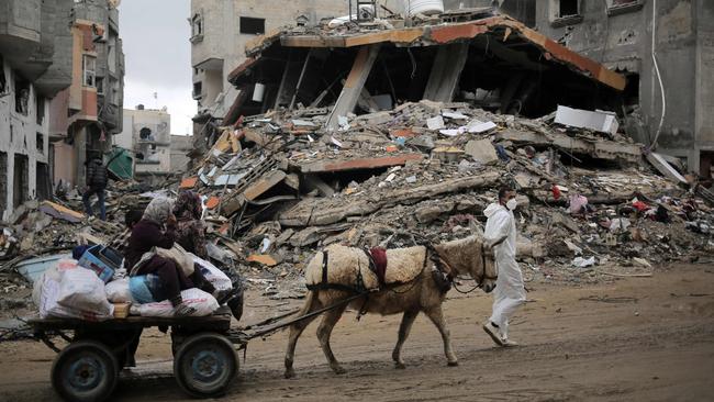 Palestinians transport some of their belongings on a donkey-pulled cart as they flee the southern Gaza Strip, amid ongoing battles between Israel and the Palestinian militant group Hamas. Picture: AFP