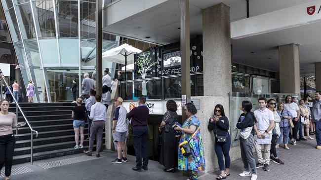 A long line outside of the Elizabeth St Transport and Main Roads office, where a lot of the people were unfortunately victims in the Optus hacking incident. Photo: Matthew Poon.