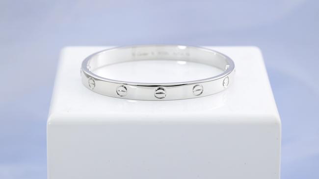 Items that were seized during Operation Elbrus, an investigation into tax fraud, are now up for auction including, , Rolex Oyster Perpetual Date Submariner, Omega Speedmaster Professional Apollo 11 45th Anniversary Limited Edition, Cartier Love bracelet in 18ct white gold, (pictured), Tiffany & Co. Elsa Peretti Diamonds by the Yard stud earrings with 2 round Natural Diamonds, Chanel medium boy flap bag in chevron quilted black