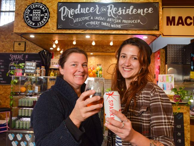 Rose Kentish, co-founder of Sparkke, and brewer Agi Gajic with their new apple cider at the central market, Tuesday, June 5, 2018. (AAP Image/ Brenton Edwards)