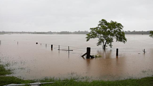 Hawkesbury river waters break the banks at Bridge st in Pitt Town closed and flooded over on the 21st of March after Sydney was lashed with huge rain fall above 100mm yesterday. Picture: Adam Yip