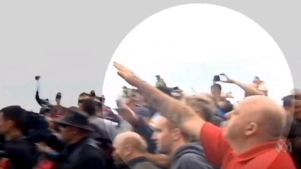 A far right extremist throws his arm up in a Nazi salute at St Kilda. Picture: ABC News