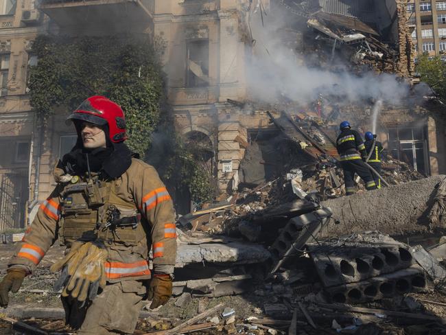 KYIV, UKRAINE - OCTOBER 17:  Firefighters appear on the scene to put out a fire in a four story residential building after a "kamikaze drone" attack early morning on October 17, 2022 in Kyiv, Ukraine. The explosions came a week after Russian missile strikes hit across Ukraine. (Photo by Paula Bronstein /Getty Images)