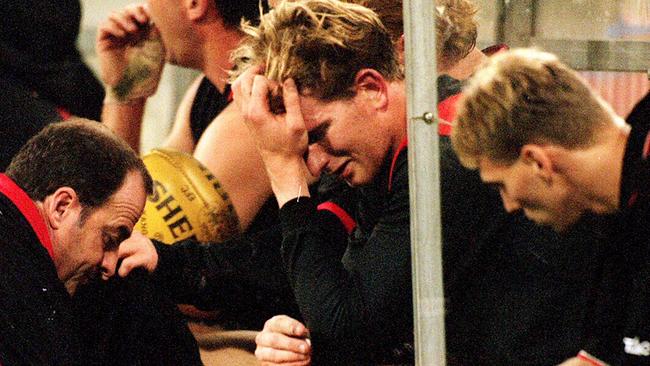 A shattered James Hird after hurting his foot in Round 2, 1999.