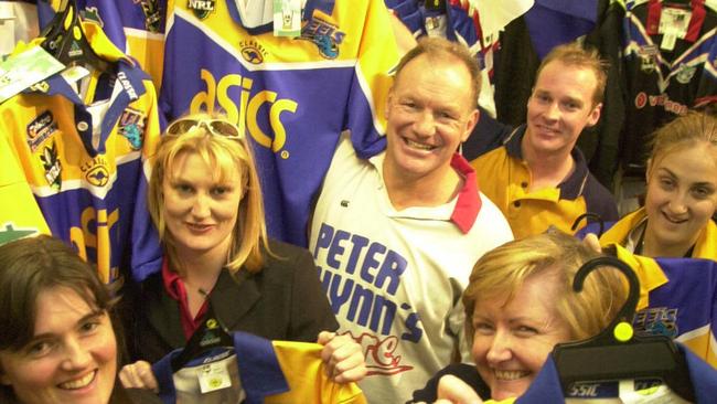 Wynn with supporters madly buying up Eels merchandise ahead of the 2001 grand final. Picture: Jeff Herbert.