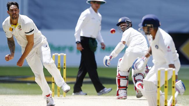 Mitchell Johnson throws the ball at Virat Kohli and hits him. Picture: Wayne Ludbey