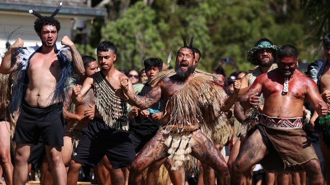 Maori dancers prepare to welcome the New Zealand government representatives, including Prime Minister Christopher Luxon, to a Waitangi Day celebration.