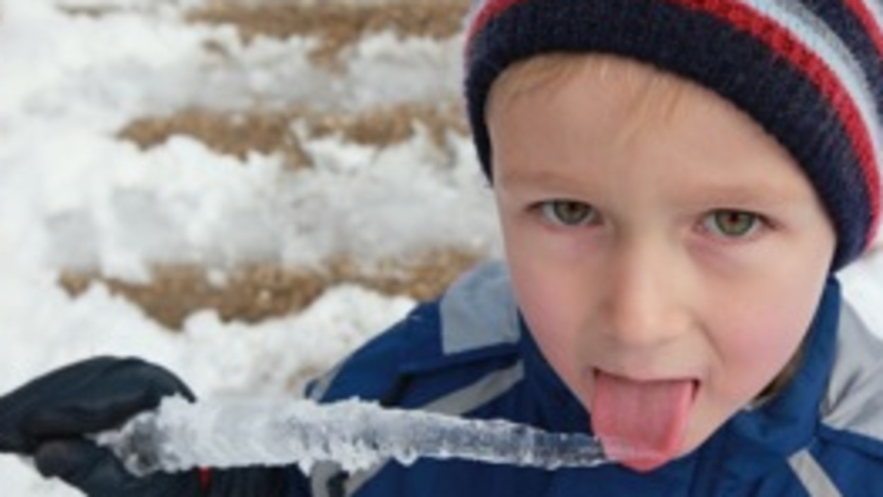 William Dallinger licking a icicle at Falls Creek in Victoria.