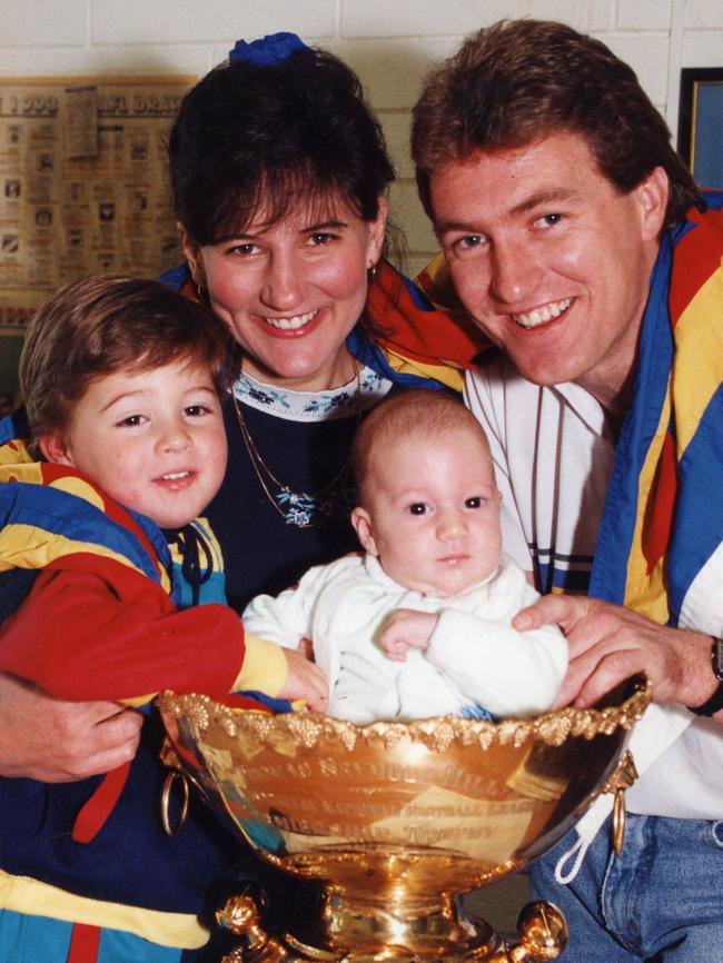 Woodville West-Torrens captain Peter Schwarz wife Katia and children Nicolas and Thomas, sitting inside the Thomas Seymour Hill trophy, in 1993. Picture: Ray Titus