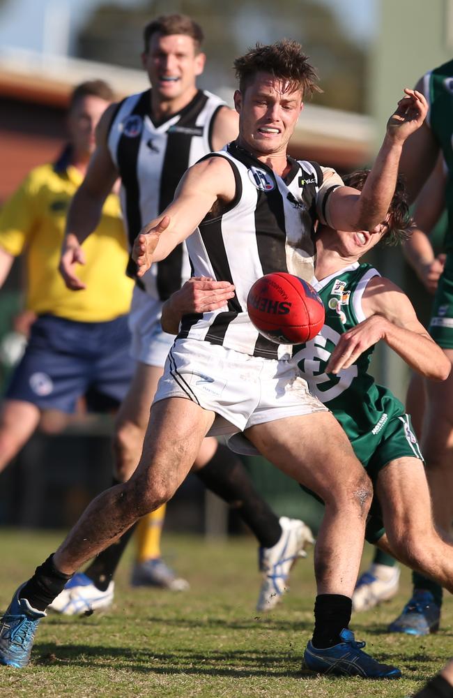 Ben Fennell playing for Montmorency against his new team Greensborough. Picture: David Crosling.