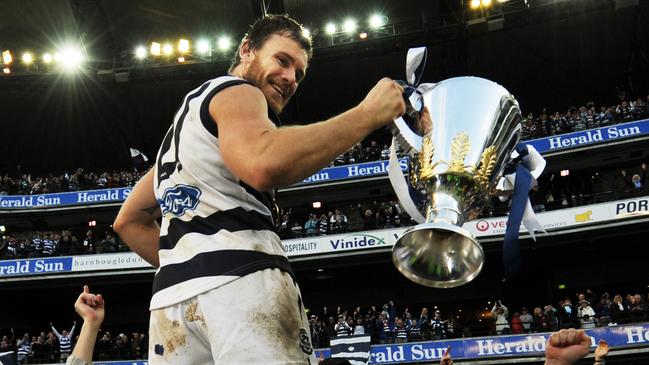 Cameron Mooney holds the 2009 premiership cup aloft.