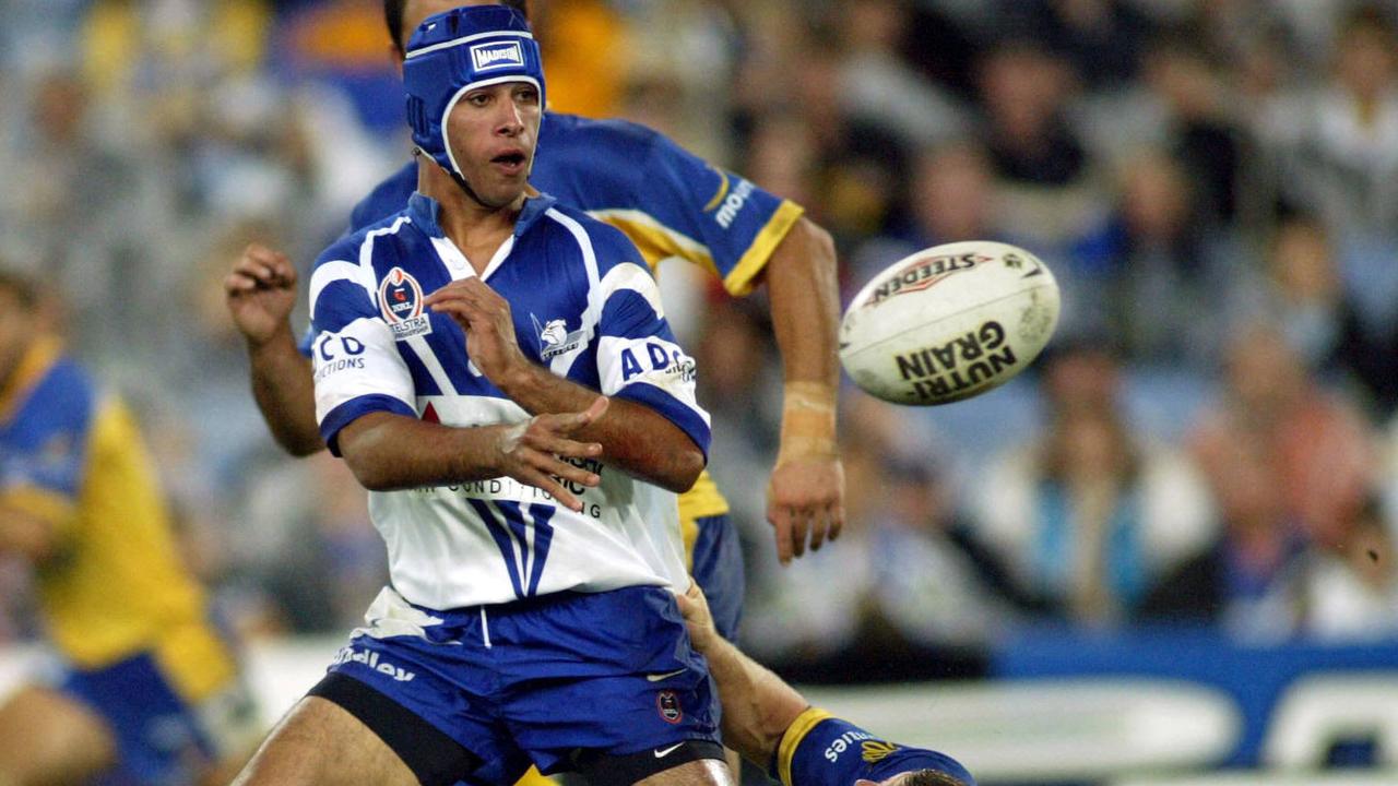 Apr 04 2003. Canterbury Bulldogs Johnathan Thurston gets his pass away during match against Parramatta at Telstra Stadium. PicMark/Evans. sport rugby league action f/l NRL