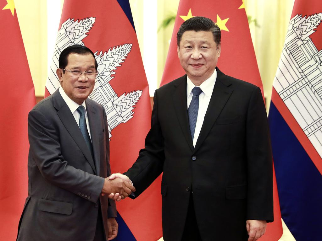 In this photo released by Xinhua News Agency, Chinese President Xi Jinping at right shakes hands with Cambodia's Prime Minister Hun Sen at the Great Hall of the People in Beijing, Wednesday, Feb. 5, 2020. Picture: Pang Xinglei
