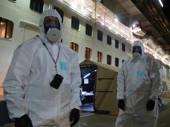 NSW Police wearing hazmat gear board the Ruby Princess cruise ship at Port Kembla. Picture: NSW Police