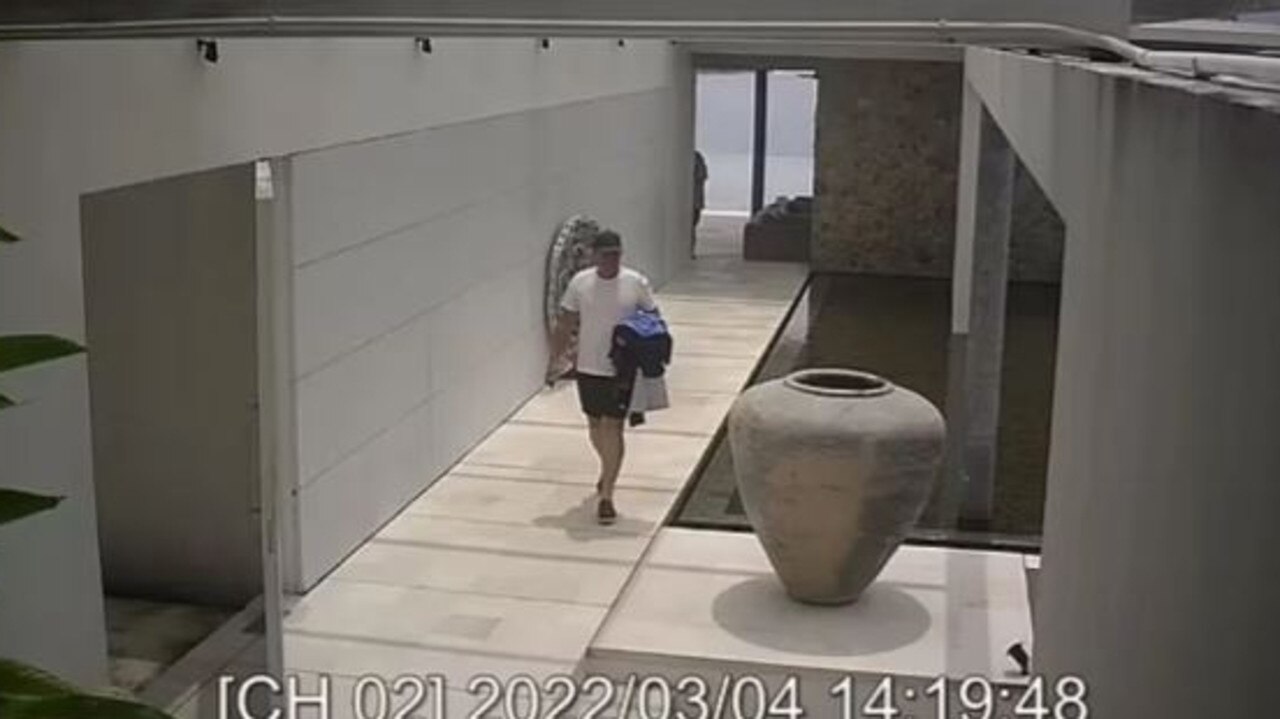 In what is thought to be the final photo of Shane Warne, the cricketer walks through his luxury villa in Thailand. Picture: CCTV