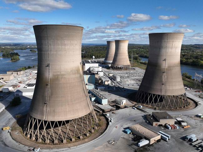 (FILES) In this aerial view, the shuttered Three Mile Island nuclear power plant stands in the middle of the Susquehanna River on October 10, 2024 near Middletown, Pennsylvania. The planned reopening of the Three Mile Island nuclear plant is praised as a boon for Pennsylvania and a boost for AI, but it is loathed by residents still haunted by a near-catastrophic meltdown (Photo by Chip SOMODEVILLA / GETTY IMAGES NORTH AMERICA / AFP)