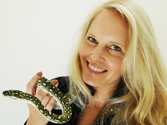 Sydney Wildlife's Lynleigh Greig pictured with a rescued Diamond Python. Picture: Braden Fastier