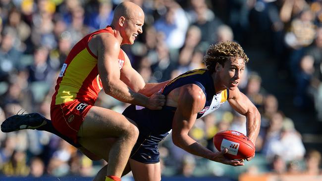 Gary Ablett battles with Matt Priddis earlier this season. Picture: Daniel Wilkins