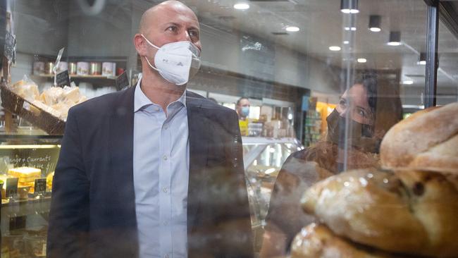 MELBOURNE, AUSTRALIA - NewsWire Photos - JANUARY 21 2022:  The Federal Treasurer, Josh Frydenberg visits Palamara Village Fruits in Mt Eliza. Picture: He is pictured with Sharon Coombes, Liberal, Candidate for Coombes (right). NCA NewsWire/Sarah Matray