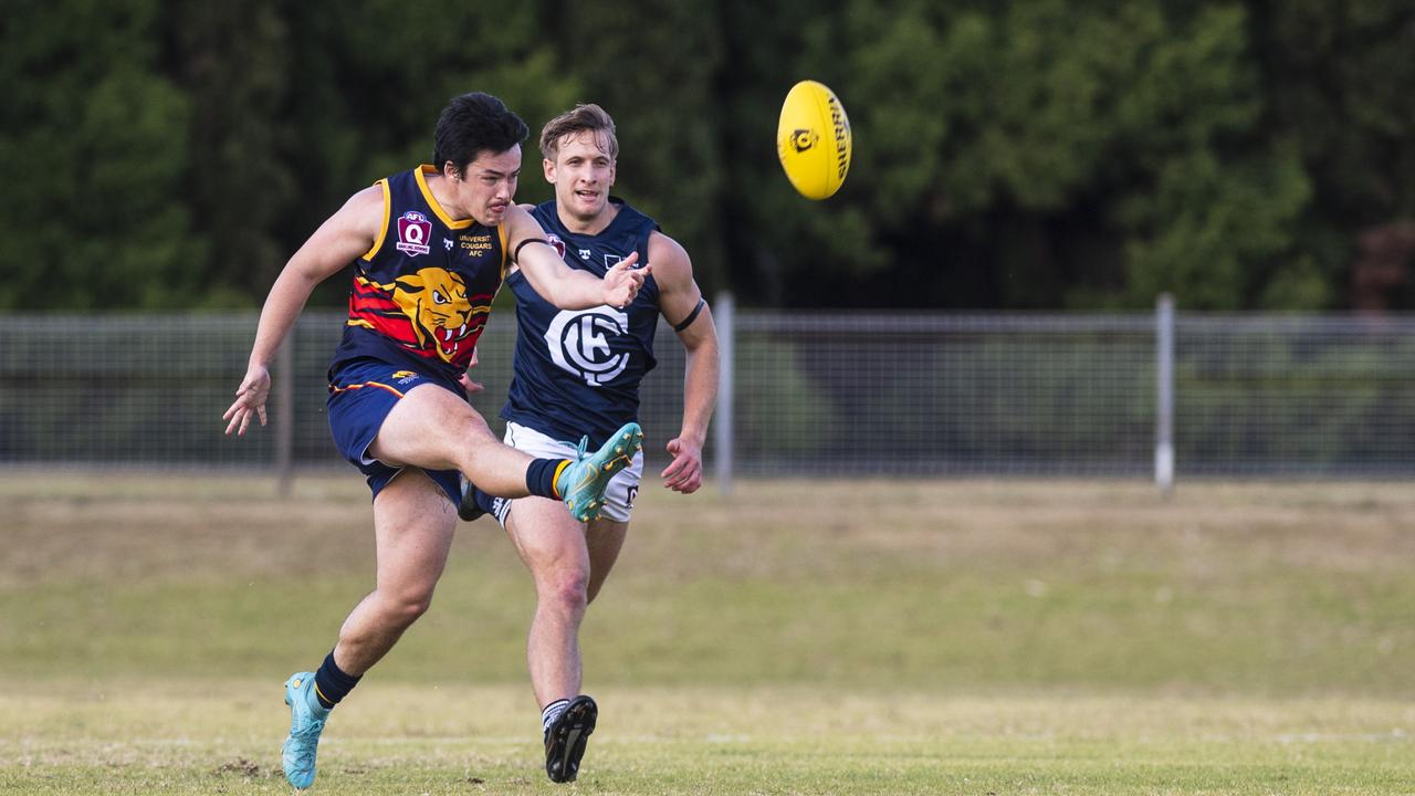 Jaiden Fidge kicks for University Cougars. Picture: Kevin Farmer