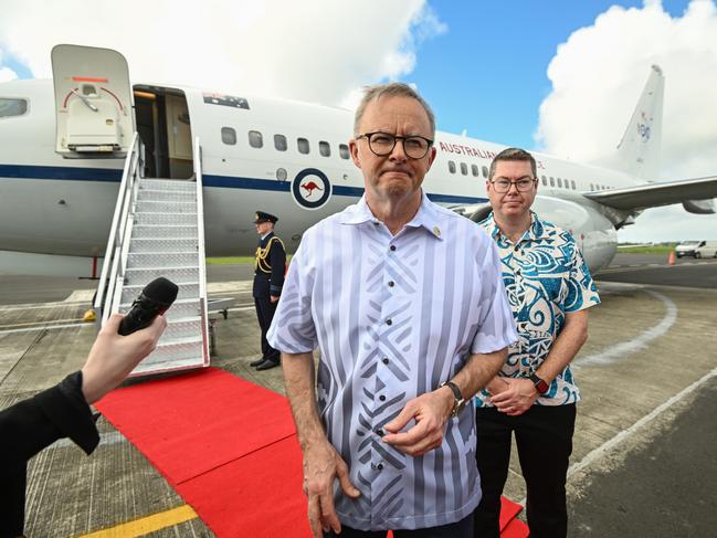 Mr Albanese fields questions from the media as he is flanked by Pacific Minister Pat Conroy at the airport in Suva. Picture: Joe Armao / Getty Images