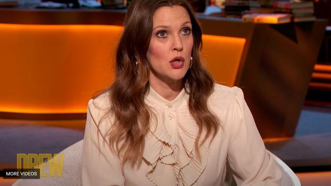 Drew Barrymore surprises couple with an impromptu wedding on her talk show.