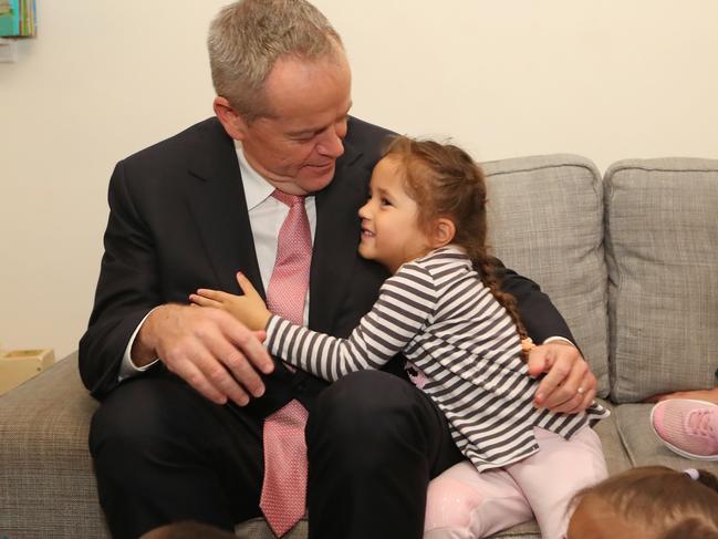 The Opposition Leader gets a hug from three-year-old Sidney Teale on a visit with Tanya Plibersek and Labor Candidate for Stirling Melita Markey to Nollamara Goodstart Early Learning Centre in Perth. Picture: Kym Smith