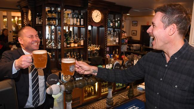 Treasurer Josh Frydenberg and former AFL footballer Matthew Richardson at the reopened Glenferrie Hotel in Melbourne on Monday. Picture: AAP