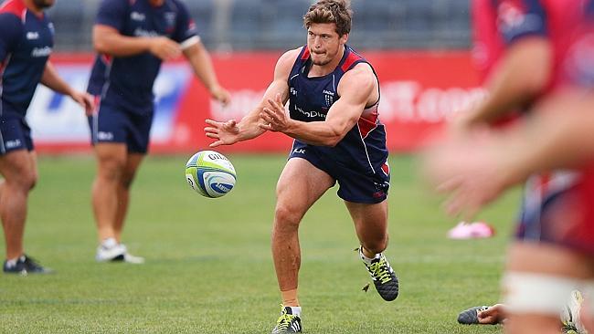 Luke Burgess fires a pass during a Melbourne Rebels Super Rugby training session at Visy Park.