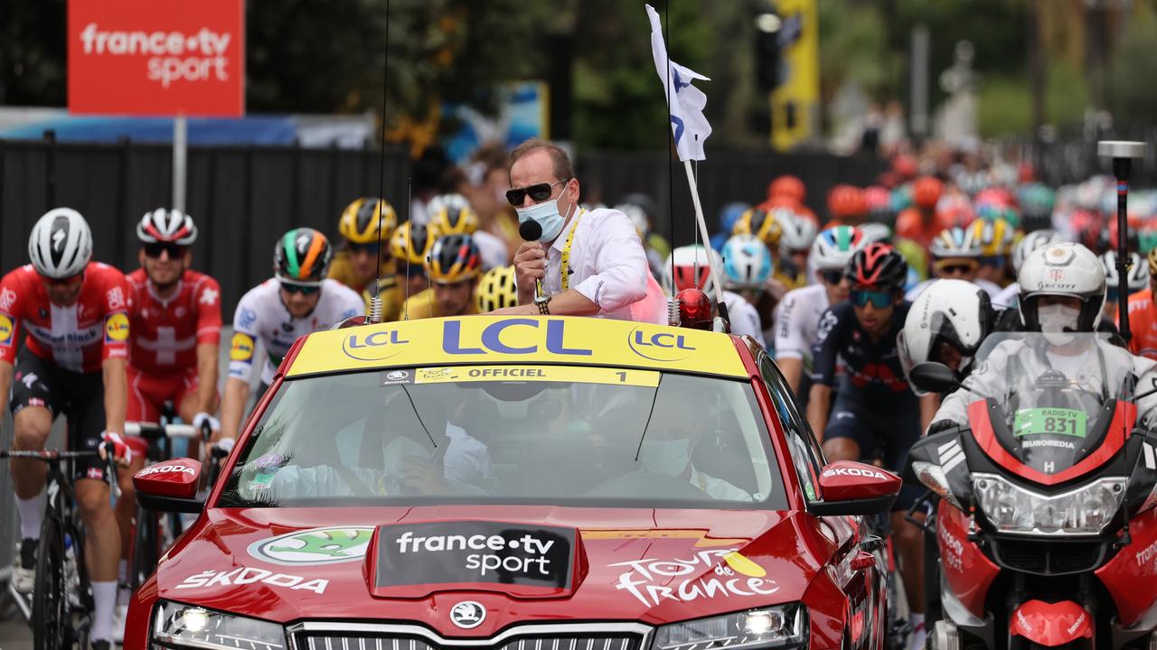 Tour de France director Christian Prudhomme (in car) has tested positive for COVID-19. Picture: Kenzo ribouillard/AFP