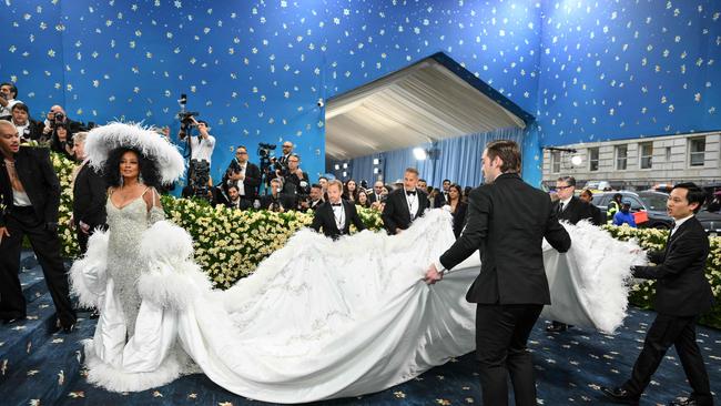 The underside of her 5.5 metre feathered train was embroidered with the names of her five children and eight grandchildren. Picture: Getty