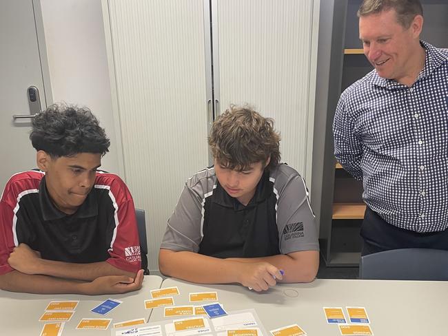 Casuarina Senior College and Clontarf Foundation students Nathaniel and Jack learn to 'budget like a boss' with the help of Bank of Queensland Qld and NSW state manager Ross Gillam.