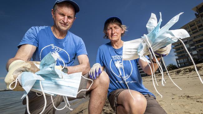 Beach Patrol president Ross Headifen and wife Ramona have personally collected more than 130 masks in the Port Melbourne area since mid September. Picture: Jake Nowakowski