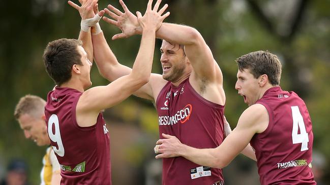 PAOC coach Craig Pitt (right) celebrates with Tomas Spanovskis and Jack Trengove. Picture: Dean Martin