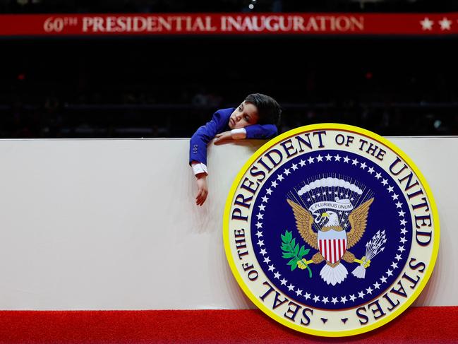 Vivek Vance, son of U.S. Vice President JD Vance, rests his head during an indoor inauguration parade at the Capital One Arena. Picture: AFP