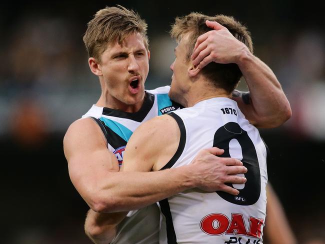 Hamish Hartlett celebrates with Port Adelaide teammate Robbie Gray after kicking a goal against West Coast on the weekend. Picture: Photo by Will Russell/AFL Media/Getty Images